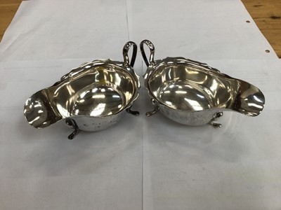 Lot 645 - Pair of silver sauce boats, together with a pair of silver fiddle pattern sugar tongs (3)