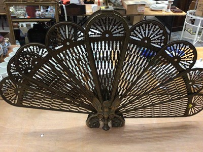 Lot 607 - Brass fan fire screen with gargoyle decoration, and a set of brass fire tools