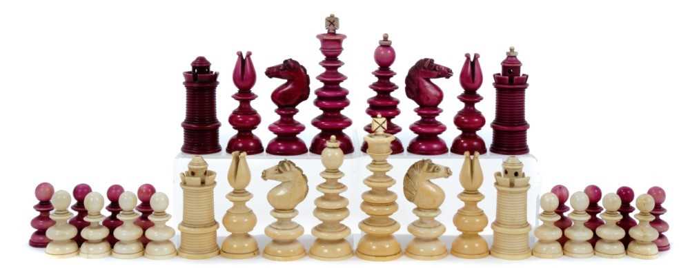 Lot 829 - Early 19th century, unsigned “Calvert” white and cerise stained ivory chess set, with turned pieces on domed bases, some minor losses, one pawn repaired. King 41/2 inches overall height.