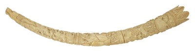 Lot 836 - 19th century Continental carved ivory Oliphant (Hunting Horn), made in two sections with three relief carved panels depicting a boar hunt, trophy of arms and entwined mythical beasts. Snarling houn...