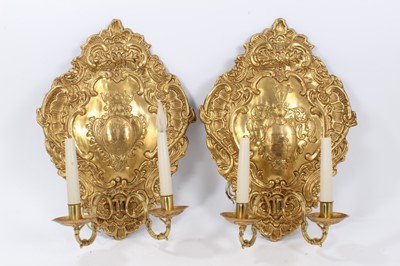 Lot 822 - Pair of embossed brass wall sconces