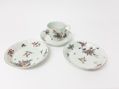 Lot 218 - A Worcester flower painted faceted coffee cup and three saucers, circa 1770