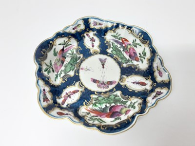 Lot 162 - A Worcester blue scale and birds teapot stand, circa 1770