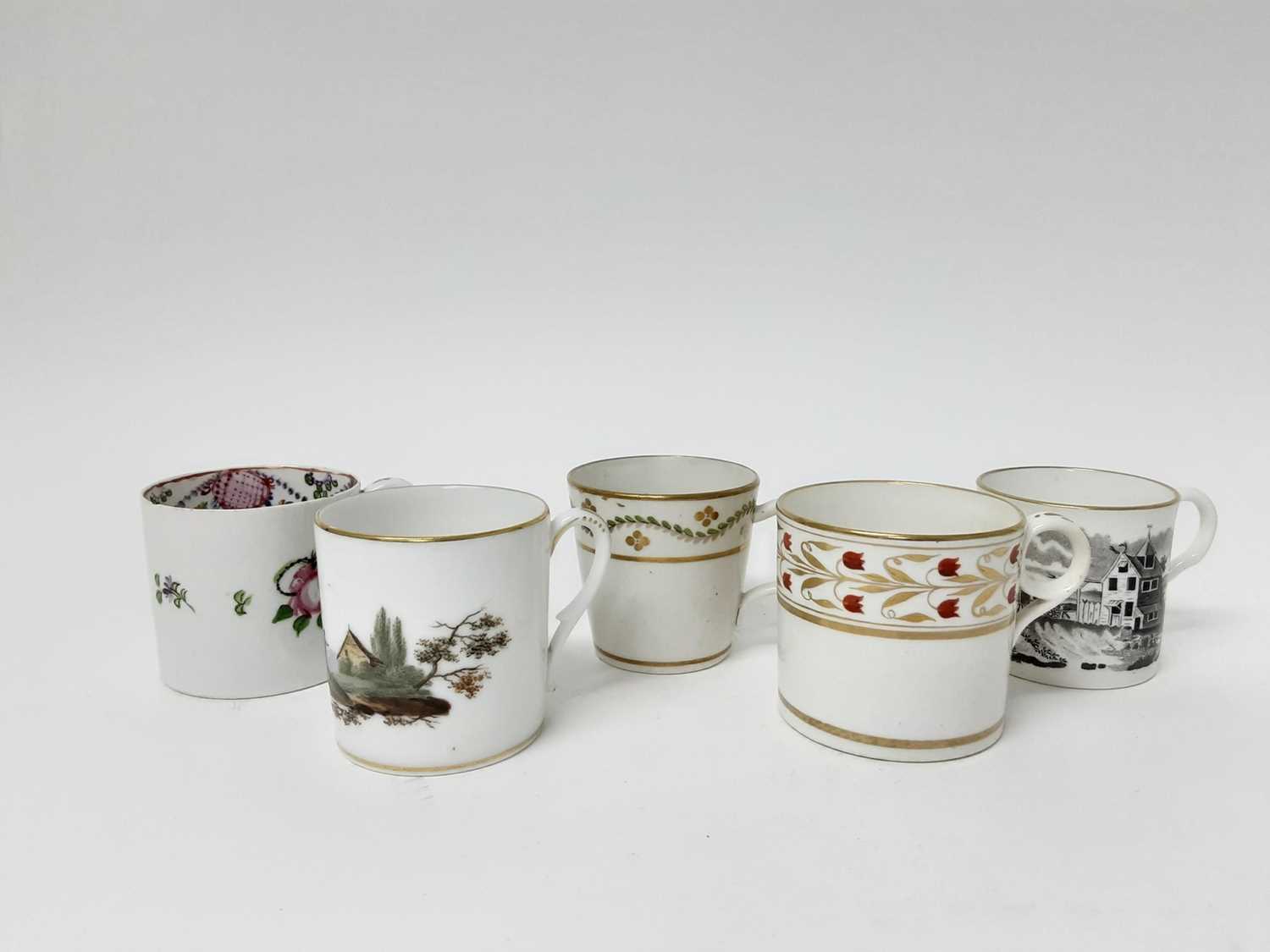 Lot 223 - An unusual Caughley bucket shaped coffee can, circa 1790, a Minton coffee can and three other coffee cans