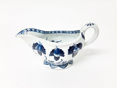 Lot 220 - A Derby blue and white sauceboat, circa 1760