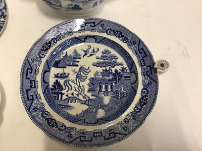 Lot 663 - Small collection of 19th century blue and white transfer ware, including a Willow pattern warming dish, a drainer printed with a rural scene, a Miles Mason teapot,  a shell-shaped dish and an irons...