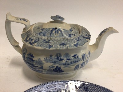 Lot 663 - Small collection of 19th century blue and white transfer ware, including a Willow pattern warming dish, a drainer printed with a rural scene, a Miles Mason teapot,  a shell-shaped dish and an irons...