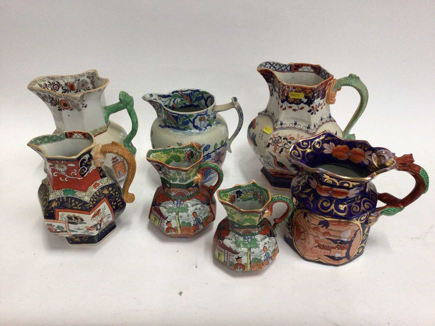 Lot 667 - Seven 19th century Masons Ironstone jugs, some with serpent handles, various patterns, sizes and marks