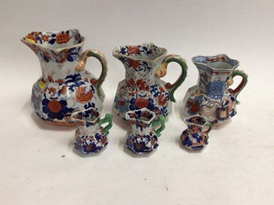 Lot 668 - Six 19th century graduated Masons Ironstone jugs, Imari patterns with serpent handles, the largest 21.5cm high