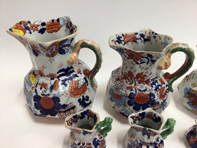 Lot 668 - Six 19th century graduated Masons Ironstone jugs, Imari patterns with serpent handles, the largest 21.5cm high