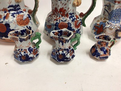 Lot 668 - Six 19th century graduated Masons Ironstone jugs, Imari patterns with serpent handles, the largest 21.5cm high