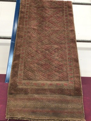Lot 8 - Pakistani runner with geometric decoration on brown and red ground 236cm x 63cm