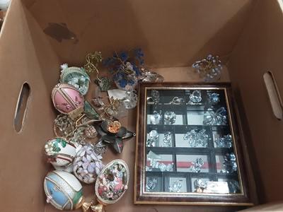 Lot 757 - Two boxes of decorative items including eggs, Swarovski style glass ornaments and china