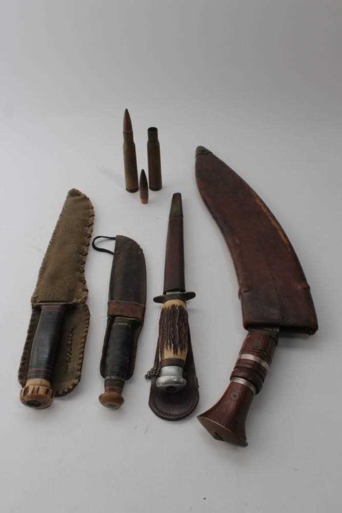 Lot 865 - Old Gurkha Kukri with wooden grip in leather