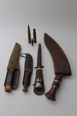 Lot 865 - Old Gurkha Kukri with wooden grip in leather covered sheath, together with an American Bowie type knife by Marbles, Gladstone, Mich. U.S.A. with wooden grip and horn pommel