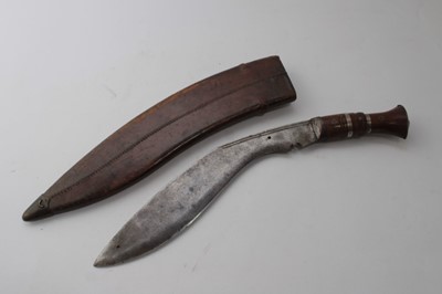 Lot 865 - Old Gurkha Kukri with wooden grip in leather covered sheath, together with an American Bowie type knife by Marbles, Gladstone, Mich. U.S.A. with wooden grip and horn pommel