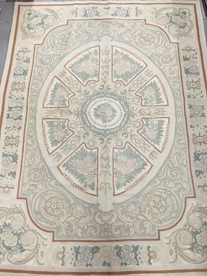 Lot 749 - An Indian Kashmiri embroided wool rug with central oval geometric panel on cream ground, bearing label for Gulam Mohidin & Son, 208cm x 153cm