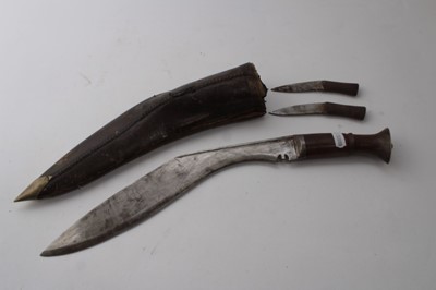 Lot 858 - Old Gurkha Kukri in leather covered sheath, together with two Persian Kabz daggers and two other Eastern daggers (5)