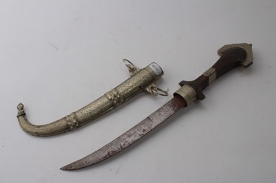 Lot 858 - Old Gurkha Kukri in leather covered sheath, together with two Persian Kabz daggers and two other Eastern daggers (5)