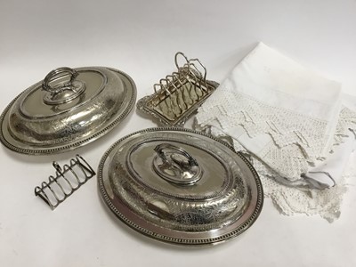 Lot 774 - Pair of silver plated entree dishes, two plated toast racks, small selection of linen and a cream telephone