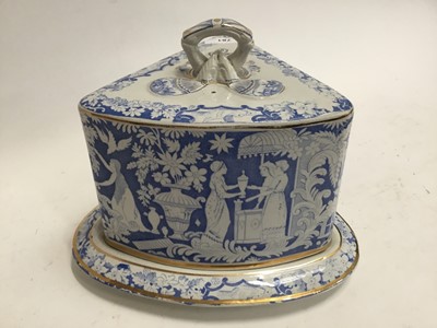 Lot 781 - Late Victorian/Edwardian blue and white cheese dish and cover of triangular form, decorated with classical scenesc