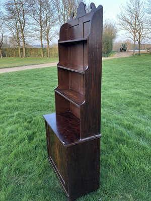 Lot 96 - 19th century mahogany and grained waterfall bookcase with scrolling top rail and graduated open shelves, enclosed panel cupboard below, on tapering legs, 78cm wide x 38cm deep x 190cm high