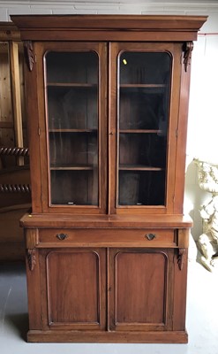 Lot 22 - Late Victorian mahogany two height bookcase with glazed doors above enclosing three adjustable shelves with single drawer and cupboard below on plinth base together with a Georgian mahogany pembrok...