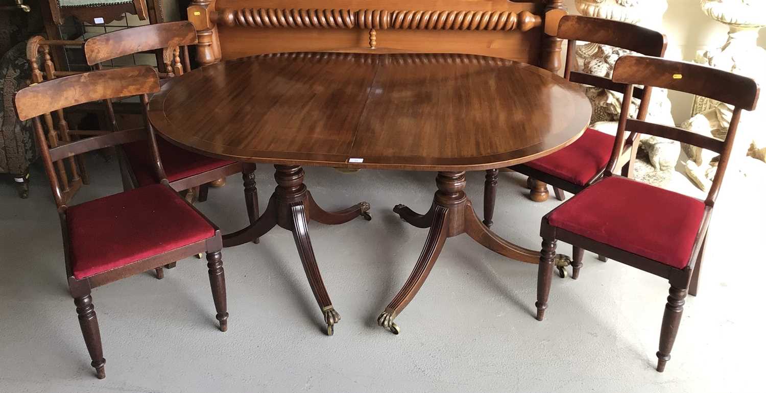 Lot 23 - Early 19th century matched set of seven chairs to include one carver and six standard together with a twin pillar D-end dining table with extra leaf and clips, table H73, W151, D102cm extra leaf W5...