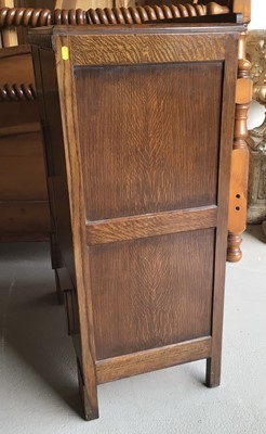 Lot 24 - 1920's oak cabinet with two panelled doors and single drawer below