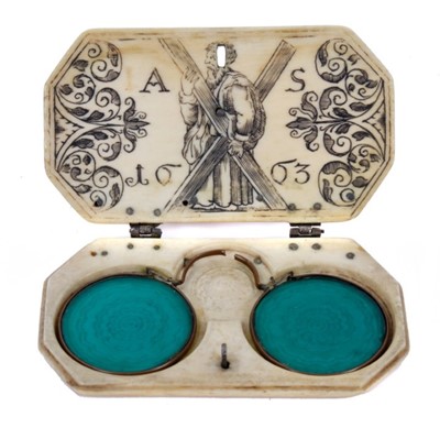 Lot 789 - Rare and fine 17th century carved ivory spectacle case of Scottish importance with pair of period sunglasses .The ivory case of rectangular form with carved roundel decoration and silver hinges and...