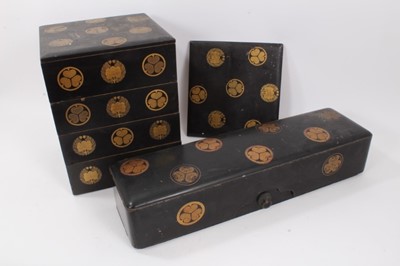 Lot 792 - Fine 19th century Japanese black and gilt lacquer stacking box in four sections  with two lids and red lacquer interiors ,33cm high, 24.5 x 26cm and another Japanese box and cover 57 cm long (2)