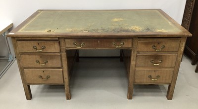 Lot 34 - Early 20th century desk with an arrangement of seven drawers, leather lined top, on block legs, 153cm wide x 87cm deep