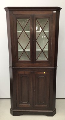 Lot 115 - 19th century mahogany two height corner cupboard, the upper glazed section enclosing shelves, above twin panelled doors, 200cm high x 97cm wide