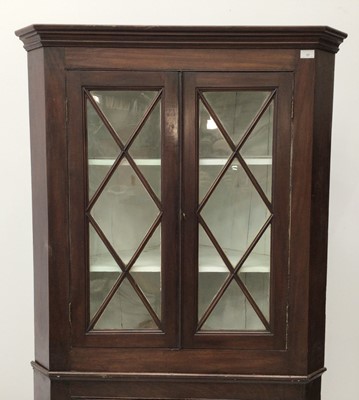 Lot 115 - 19th century mahogany two height corner cupboard, the upper glazed section enclosing shelves, above twin panelled doors, 200cm high x 97cm wide