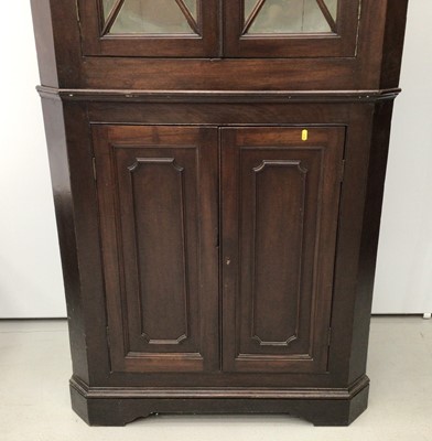 Lot 37 - 19th century mahogany two height corner cupboard, the upper glazed section enclosing shelves, above twin panelled doors, 200cm high x 97cm wide