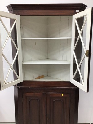Lot 37 - 19th century mahogany two height corner cupboard, the upper glazed section enclosing shelves, above twin panelled doors, 200cm high x 97cm wide
