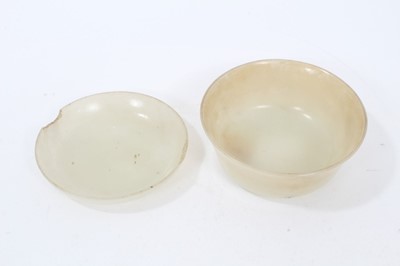 Lot 794 - Fine 18th/19th century Chinese carved jade brush washer of flared bowl form with carved clouds to base 8.2 cm diameter, 3.5 cm high and a jade shallow brush washer 8cm diameter (2)
