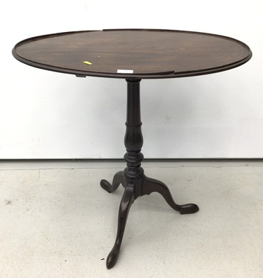Lot 39 - 19th century mahogany tripod wine table, the oval top raised on turned column and three splayed legs, 69cm x 47cm