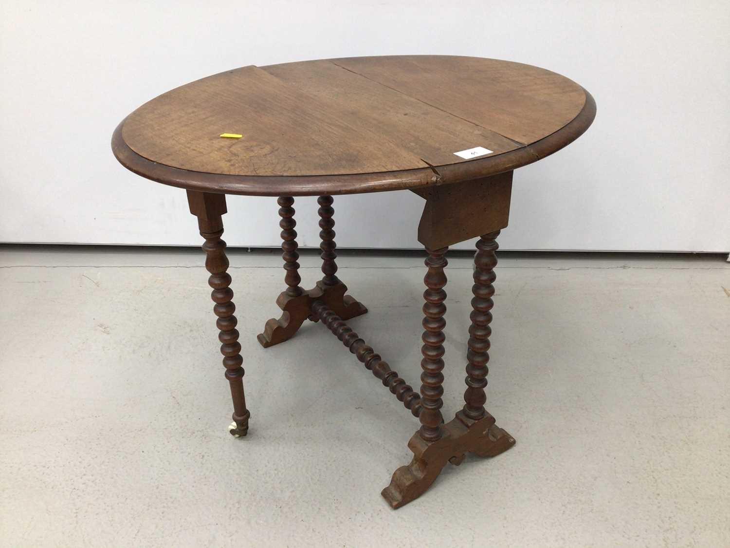 Lot 41 - Edwardian mahogany Sutherland table with oval drop-flap, on bobbin turned supports, 66cm when open x 53cm wide x 50cm high