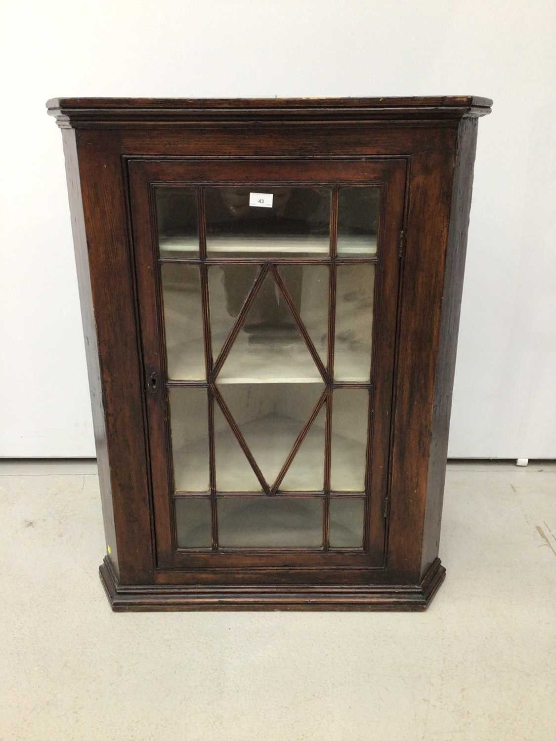 Lot 43 - 19th century stained pine corner cupboard with glazed doors enclosing shelves, 76cm wide x 97cm high