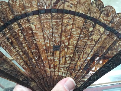 Lot 795 - Fine 19th century Chinese export carved tortoishell fan with finely pierced figure and landscape decoration , opening to 33 cm wide  19 cm high.