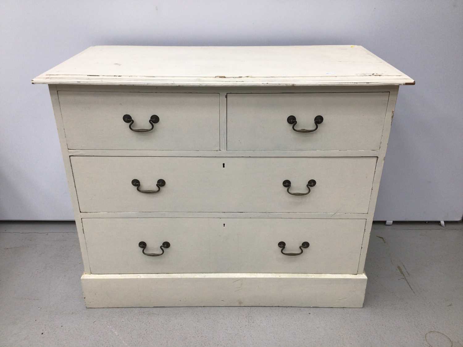 Lot 133 - Edwardian white painted chest of two short and two long drawers, with brass handles, 103cm wide x 49cm deep x 84cm high