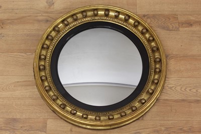 Lot 1451 - 19th century gilt framed circular convex wall mirror with ball mounts