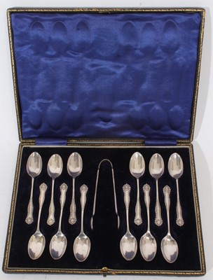 Lot 310 - Set of Twelve Edwardian silver teaspoons, together with matching sugar tongs, in a fitted case (London 1908), maker William Hutton & Sons Ltd, all at approximately 8oz