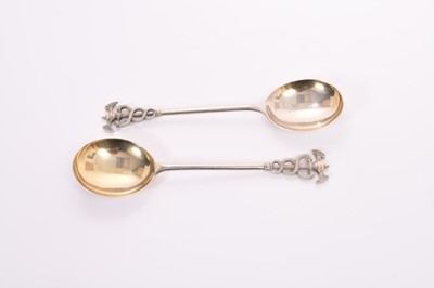 Lot 317 - Pair of George V silver serving spoons with gilded bowls and terminals of the stems each bearing the iconography of the God Hermes (London 1918), maker Goldsmiths & Silversmiths, all at 7oz, each 2...