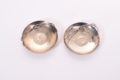 Lot 328 - Pair of Chinese silver dishes of circular form, set with coins, one on a planished ground, both with simulated bamboo handles, marked Sterling, all at approximately 7oz, 10.5cm in diameter