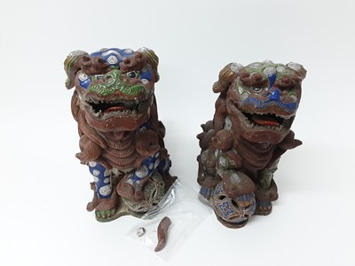 Lot 148 - Pair of large Japanese pottery dog of Fo ornaments