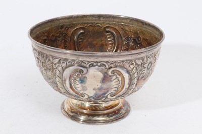 Lot 334 - Victorian silver rose bowl of conventional form with embossed floral, foliate and scroll decoration, raised on a circular pedestal foot, (Sheffield 1902), maker Thomas Bradbury & Sons Ltd, 15.7cm i...