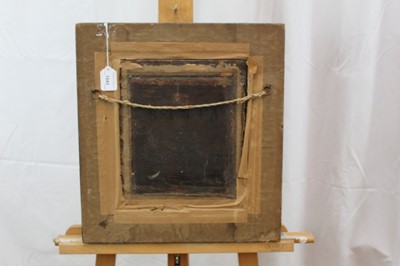 Lot 1243 - Studio of G. Schalken oil on panel - lighting a pipe, in ebonised frame
