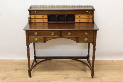 Lot 1428 - Edwardian inlaid mahogany desk with barrel front and an arrangement of drawers